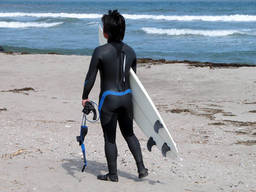 Young surfer prepares to hit the waves