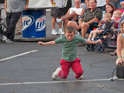 Little boy showing what he's got through simple breakdance moves.