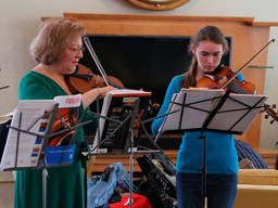 This young girl is preparing for a viola recital