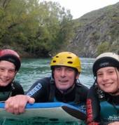 Happy family on the river