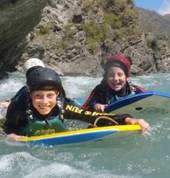Kids having a blast riversurfing