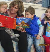 Reading books, visiting the Library, children play active roles in the reading of a story