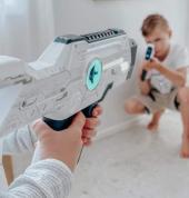 Kids playing laser tag indoors with Laser Tag Hire NZ, enjoying an active, fun-filled game that's perfect for birthday parties, family events, and group entertainment.