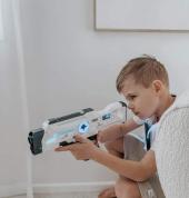 Child playing laser tag indoors with Laser Tag Hire NZ, enjoying an exciting, active game that's perfect for birthday parties, family events, and school holiday fun.