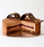 Noah birthday cake is made of dark and milk chocolate mousse, praline crunch, chocolate sponge and cassis blackcurrant coulis. Serves 5-8.