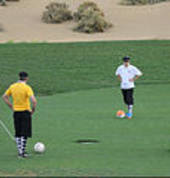 FootGolfers reay to putt there ball.