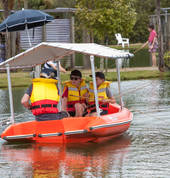 Fishing from row boats at Huka Prawn Park