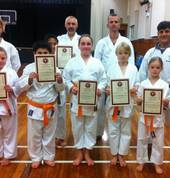 Kids karate class orange belt graduates