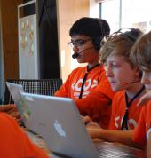 Kids coding on their laptops