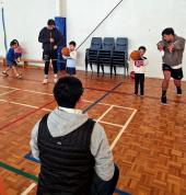Coaches teaching passing for 5yr olds