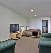 Family unit - Has 3 x 2-seater couches, a table that seats 6 and a full kitchen.